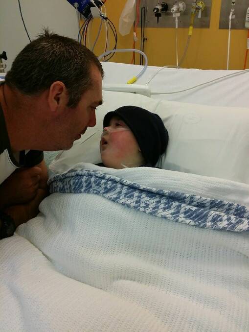 Justin Cordell shares a special moment with his little fighter Callum.