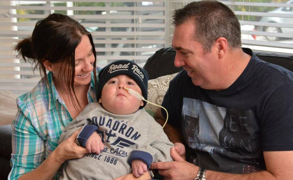 Precious boy: Jenny and Justin Cordell with their little angel Callum during his long battle with multiple auto immune disease. He lost that fight last year and his parents have, in his memory, started Callum's Pyjama Party in his honour.