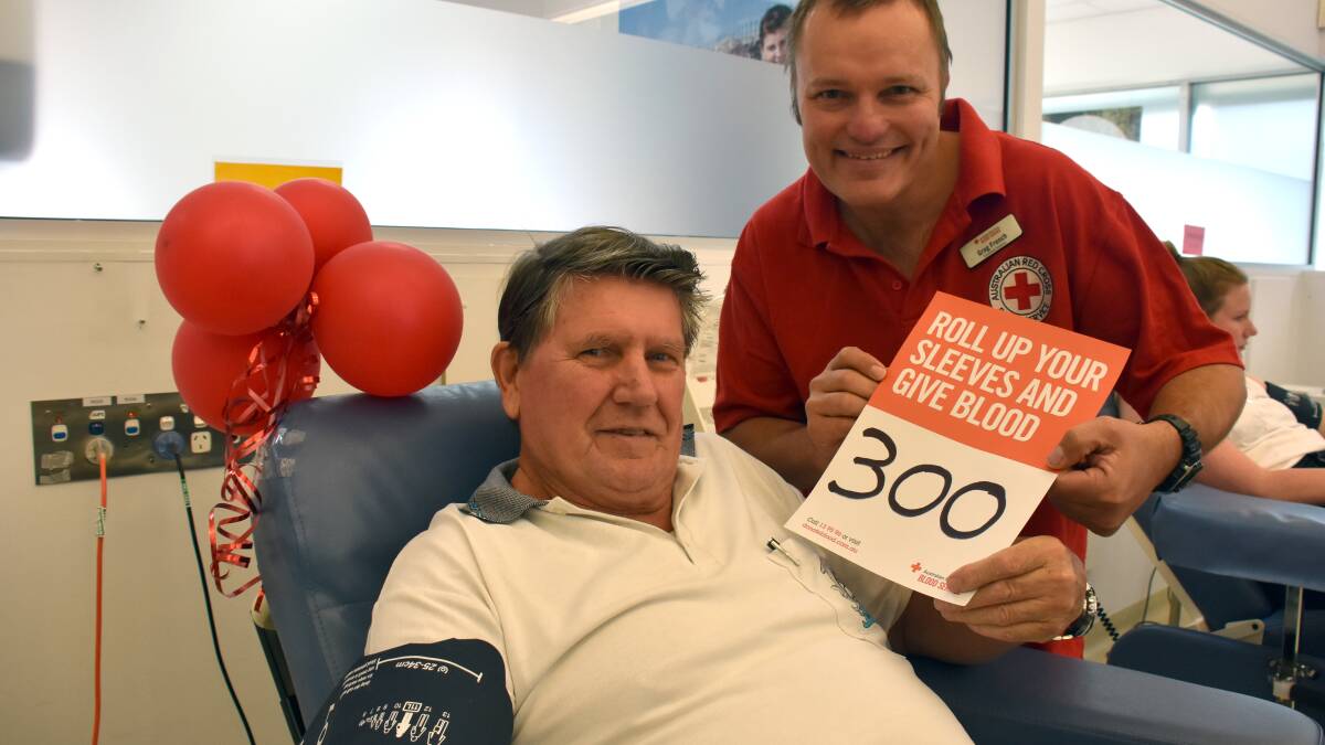 Thank you: Blood donor Dave Clark makes his 300th donation as Australian Red Cross Blood Service community relations officer Greg French recognises the milestone.