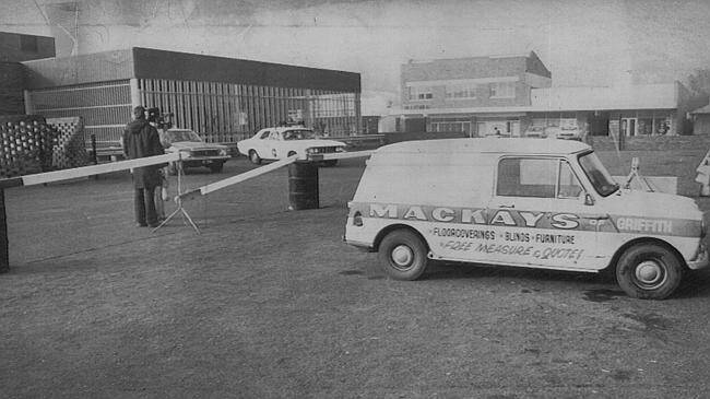 CRIME SCENE: Donald Mackay's minivan in the car park of the Griffith Hotel.