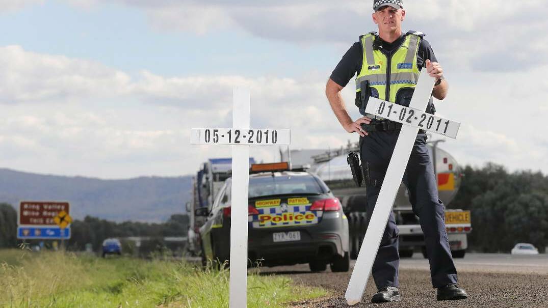 BORDER: Fifty kilometres, 12 white crosses, each representing a life lost and a family forever shattered. For those driving on the stretch of freeway between Springhurst and Glenrowan over the Easter break, the crosses will be a stark reminder of the reality of our road toll. Highway Patrol Sgt Michael Connors, pictured, sought approval from police command and VicRoads to line the stretch of freeway with the crosses in a bid to reach out to drivers on one of the country’s busiest roads, at one of its busiest times of year. Picture: John Russell/Border Mail