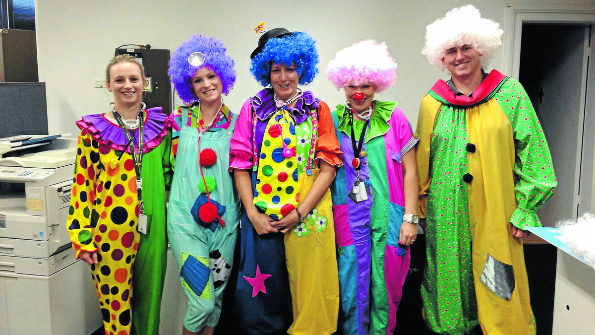 FORBES: The Forbes branch of Commonwealth Bank invited local residents to join in on the fun as they ‘clowned around’ to help raise funds and big smiles for Clown Doctors. Staff at the Forbes bank branch dressed up in colourful costumes and held a raffle to give away a basket full of chocolates. Picture: Daily Liberal