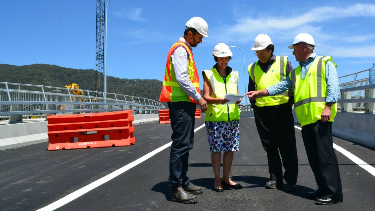 BRIDGE BUILT: Gary Randall (PMHC), Leslie Williams MP, John Alexander (RMS) and Terry Sara (Office of Leslie Williams) on the northern side of the new bridge.
