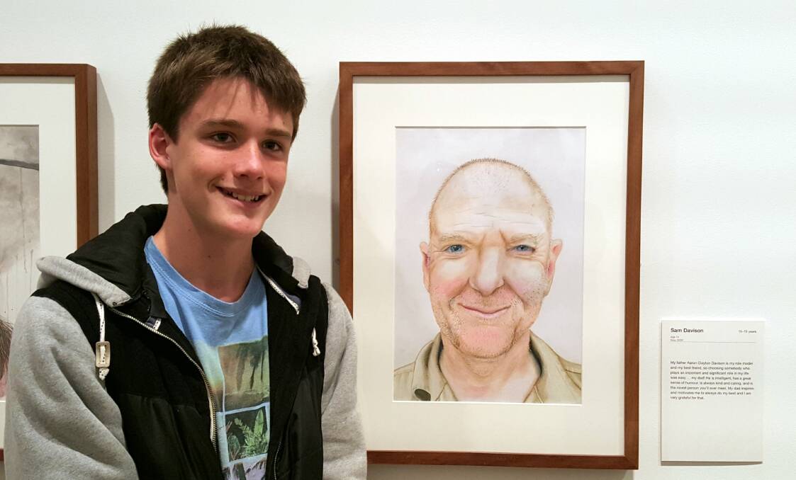 BUDDING ARTIST: Sam Davison with the coloured pencil portrait of his father which is among the artworks in the running for a Young Archie prize.