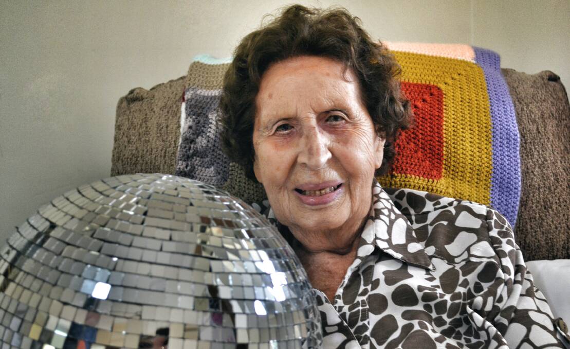 DISCO TIME: Thelma Chandler her friends and carers were treated to a discotheque-themed party at the Widdon Group Laurieton dining room, complete with mirror ball, coloured lights and a DJ.