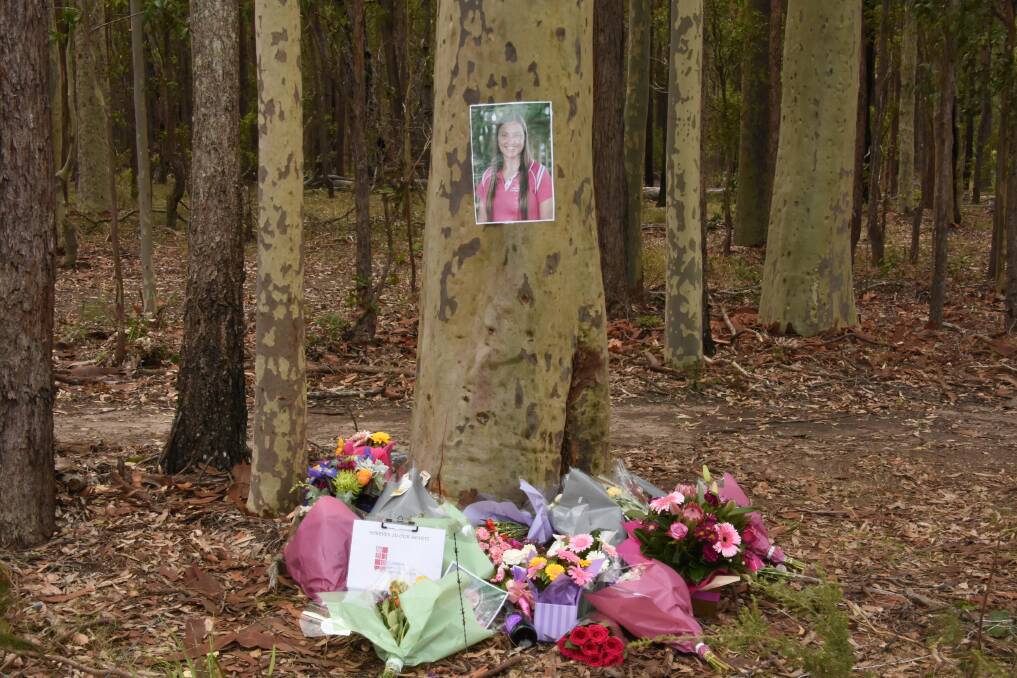 Tragedy: An array of flowers and candles have been left at the scene as tribute to Abbey Stephen. Photo: Scott Calvin. 