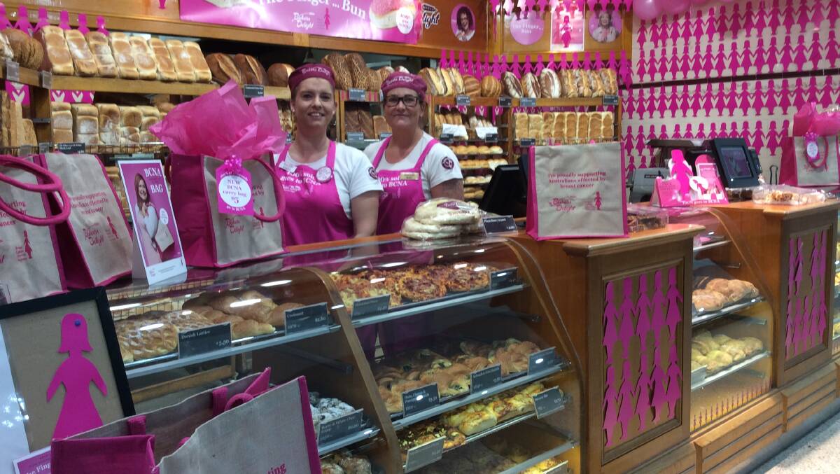 Sold out: Crystal and Mary from Bakers Delight in Settlement City. Pink buns have been selling like hot cakes.