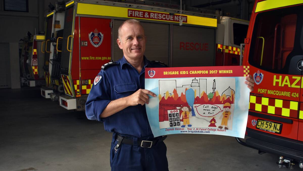 Port Macquarie station officer Shane Malagre promoting Open Day.