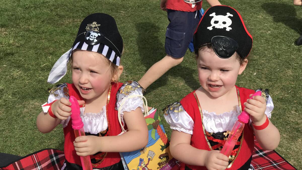 Twinsies: Matilda Daisley and Mia Downes had matching outfits - and matching bubbles - for the Big Dig at Town Beach. Photos: Matt Attard