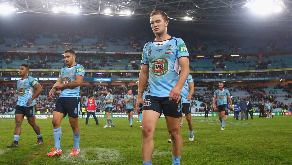Dejected: NSW players leave the field at the end of State of Origin game one. Photo: Getty Images.