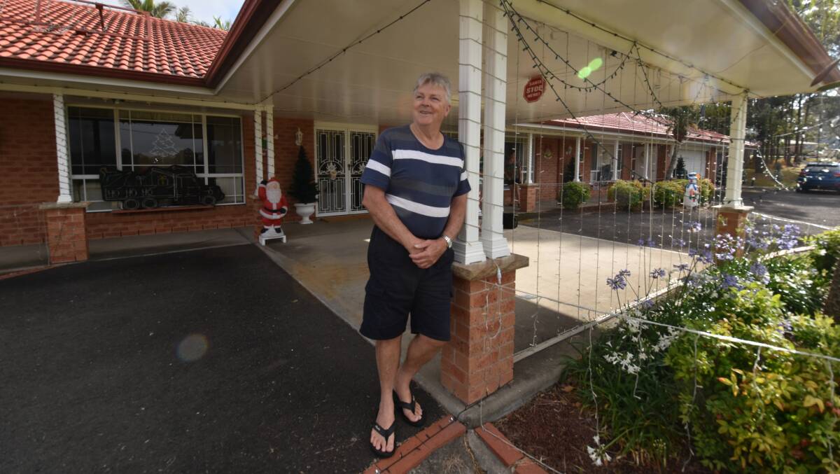 Well decorated: Rod Lane outside his home, which is full to the brim with Christmas lights and displays. 