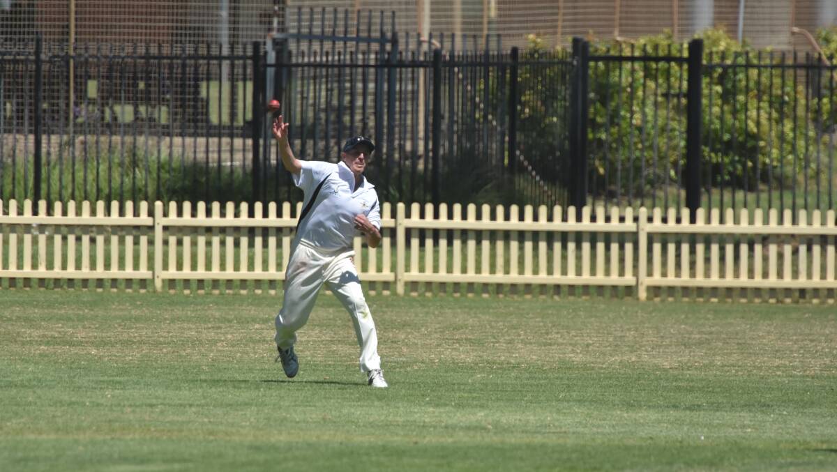 Big throw: Richard Rollands, of Tamworth, goes for the stumps during their clash at Oxley Oval.