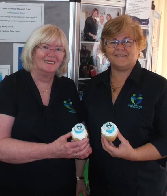 Meals with a smile: Port Macquarie Branch Support Officers Kym Theofanou and Chris Witt with the cupcakes clients received.