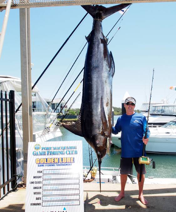 What a catch: Angler Rob Webber from the boat Ellmad with his monster blue marlin that weighed 164 kilograms. Photo: Mike Kane