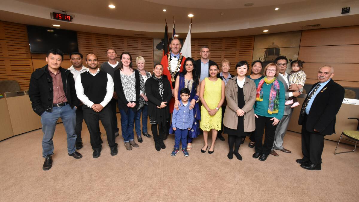 Proud Australians: Mayor Peter Besseling with Uncle Bill O'Brien, Megan Cooper and the new Australian citizens.