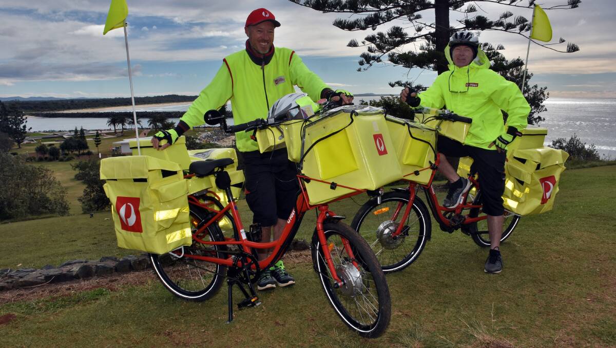 Graeme Wilson and Dennis van der Velde are the lucky local postmen who have been riding the electric push bikes for the past three weeks.