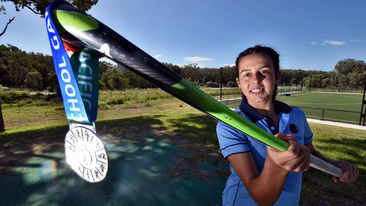 Off to South Africa: 16 year old Port Macquarie hockey striker Annika Toohey with her NSW All Schools medal. Next step, the Aussie team. Photo: Matt Attard