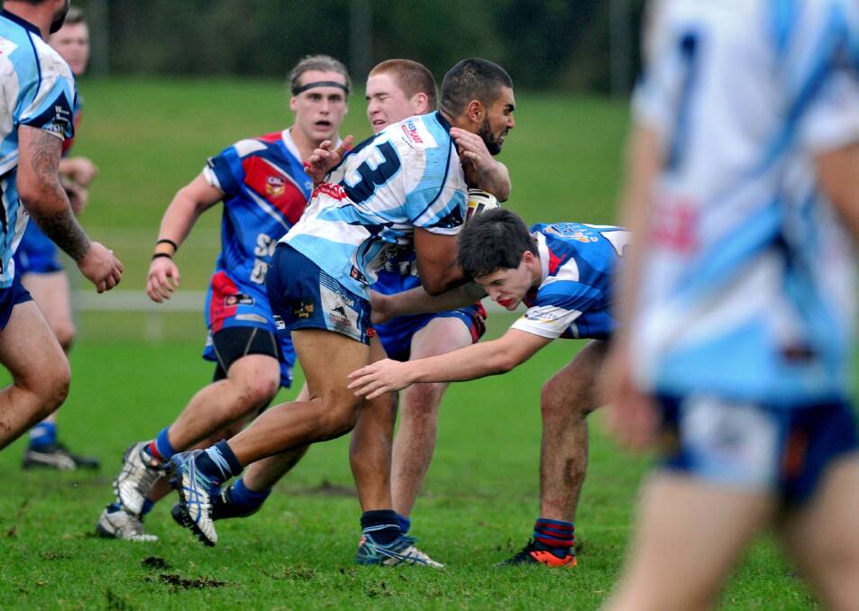 Top of the table: Ritchie Roberts runs into the Wauchope Blues young guns on the way to a big win on Saturday afternoon. Photo: Matt Attard