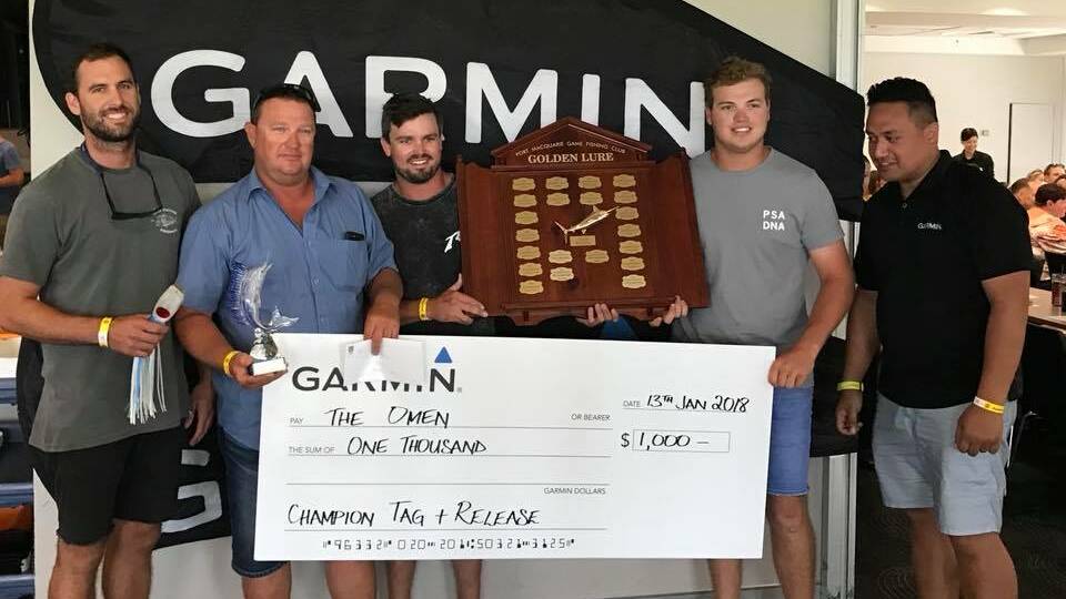 The Omen: The Golden Lure champion tag and release crew with their winners shield and trophies. Photo: Supplied
