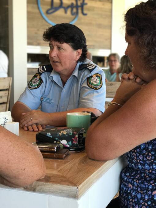 Happy to chat: Police youth liaison officer Wendy Hudson shares a coffee and has a chat with locals on Thursday morning. Photo: Matt Attard