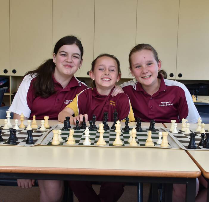 Winners are grinners: Emily Sharp, Chloe Day and Grace-Anne Pegler came second at the Sydney Academy of Chess NSW Girls Chess Challenge last week. Photo: Matt Attard