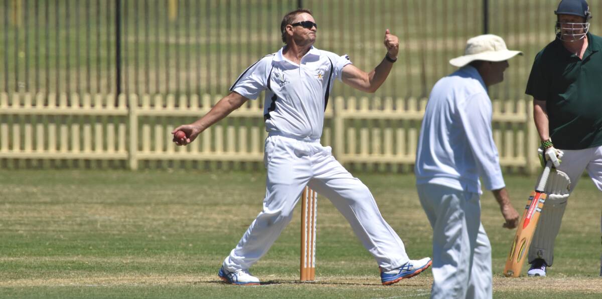 About to deliver: Tamworth bowler Roger Gaughtey prepares to send down an in swinger at Oxley Oval.