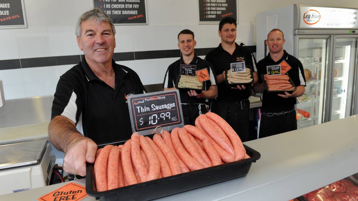 Snagin' it up: Port Meat Store owner Larry Dickson with butchers Toby Stace, Tristan Clarke and Daniel Johnson with the sausages they will enter into the AMIC NSW/ACT Sausage King Competition. Photo: Matt Attard