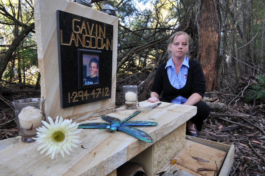 Disgusting: The Langdown family are upset at the callous act of someone who destroyed the memorial to Gavin on Blackmans Point Road. Adele Langdown is pictured at the site after it was cleaned up.