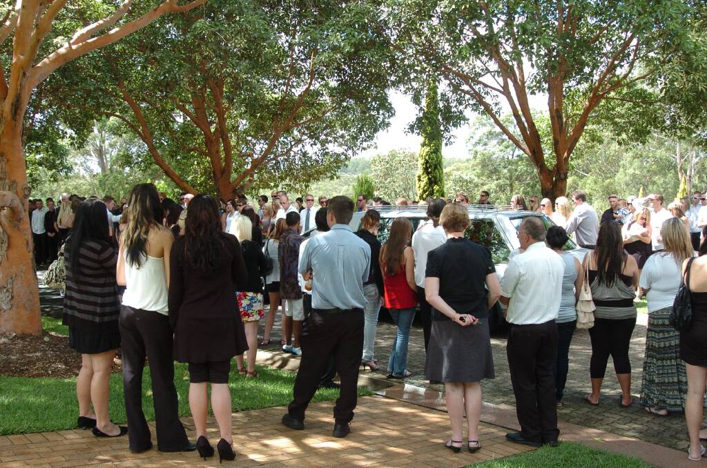 A devastating loss: Family and friends bid farewell to a much-loved Mitch Voysey during an emotional funeral at Innes Gardens Memorial Park Chapel on March 4, 2010.
