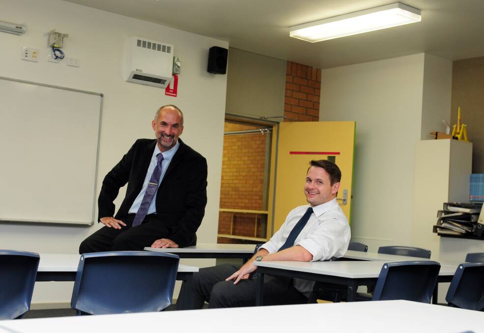 Revolutionary move: Director, Public Schools NSW (Hastings) Mark Youngblutt and NSW Teachers Federation regional coordinator Ian Watson welcoming the announcement at Westport High School on Tuesday.