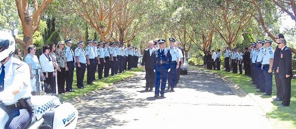 Paying their respects: Senior Constable Graham Wright is remembered with respect and fond memories at a full police funeral yesterday.