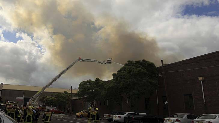 "Three to four storeys high" ... the fire burns at a factory in Marrickville.
