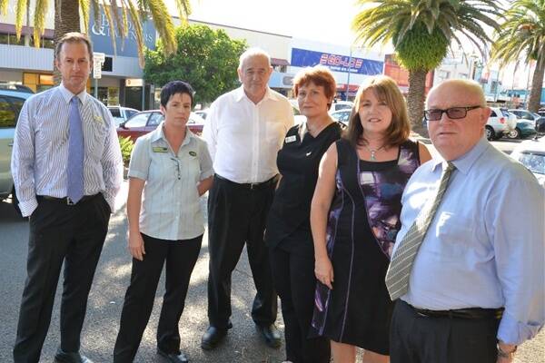 Parking plea: Laing + Simmons licensee Chris Koch, Caron Dyball from Snap Printing, Port Macquarie Travel’s John Joyce, Trendz Beauty and Training massage therapists Tess Wright and Karen Aide, and chartered accountant Peter Bugden support two-hour parking.