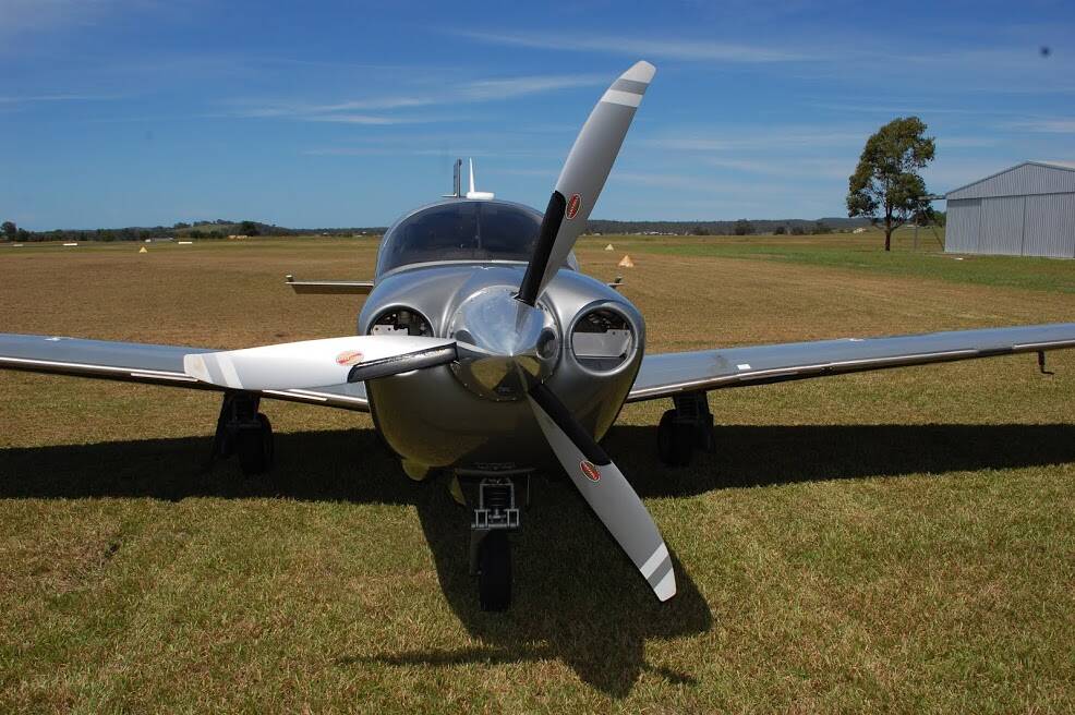 Bad luck: The left-most propeller blade and the wing on the right are bloodstained after this Mooney aircraft hit and killed a kangaroo at Kempsey Airport on Tuesday.