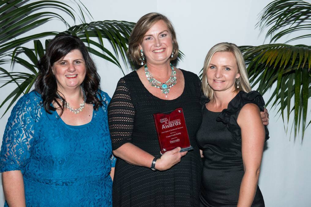 Port News's Cathie Linklater presents Coast Front Realty with the Real Estate and Residential Services award: Sue Jogever and Kristir Geronimi celebrate.