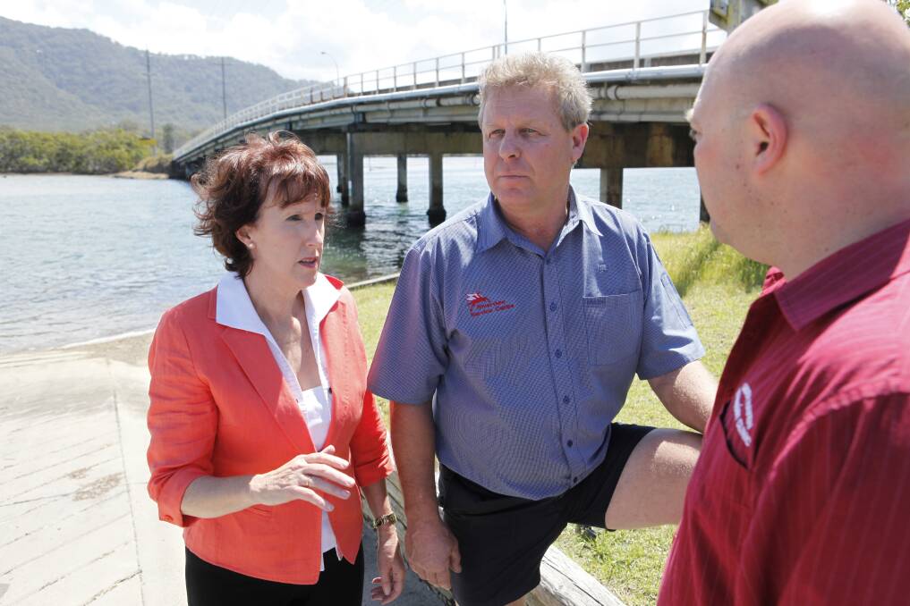 MP Leslie Williams with disappointed long-time Camden Haven businessman Keith Dykes, who does not understand council's change of mind, and Gavin Rippon at Stingray Creek Bridge.