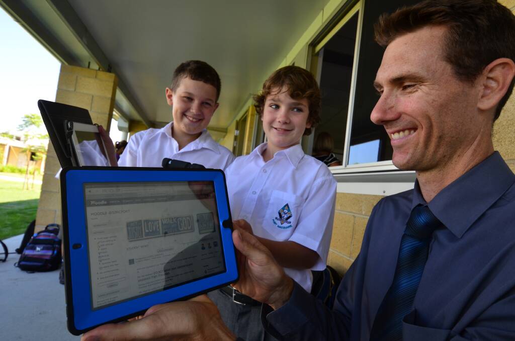 Tom Slater and Jake Reiffel from St Joseph's chat with leader of Pedagogy, Chris Delaney.