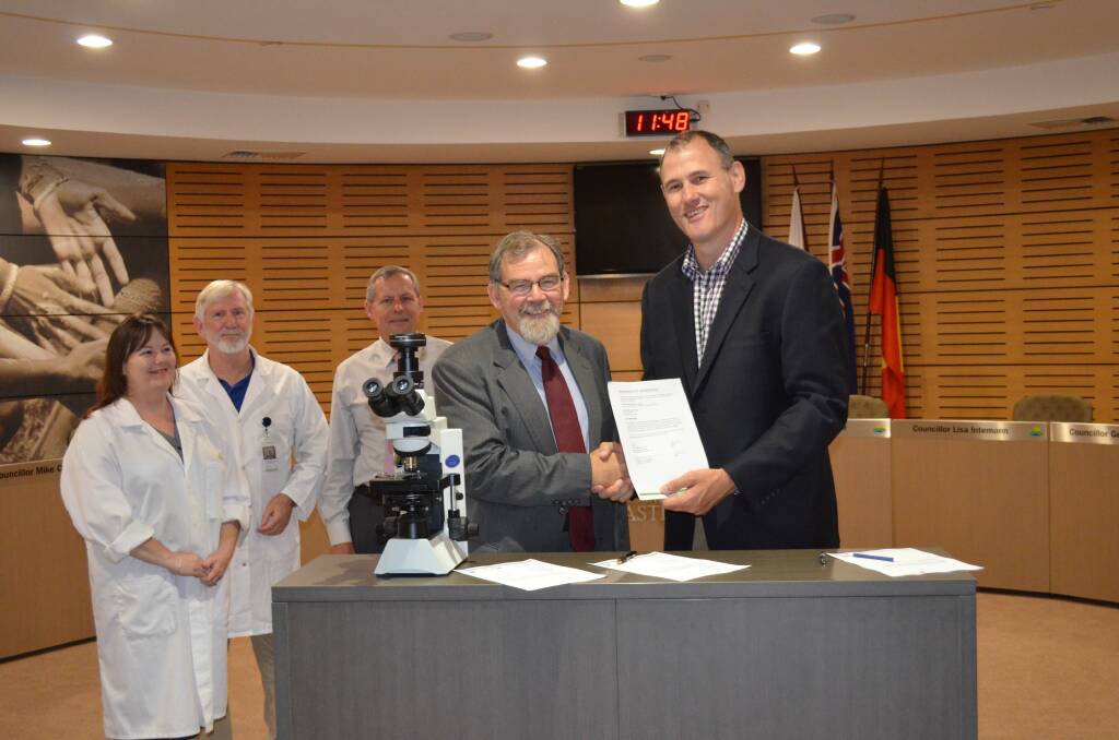 Science focus: Laboratory manager Dr Maree Smith, senior scientist Mike Hawtin, Port Macquarie-Hastings Council general manager Tony Hayward, Charles Sturt University's Professor Ross Chambers and mayor Peter Besseling at the partnership signing.