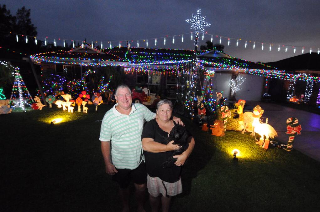 Twinkle, twinkle: Les and Denise Graham take great pleasure in providing a brilliant Christmas lights display at their Newmarket Grove home (see story on Christmas lights competition below).