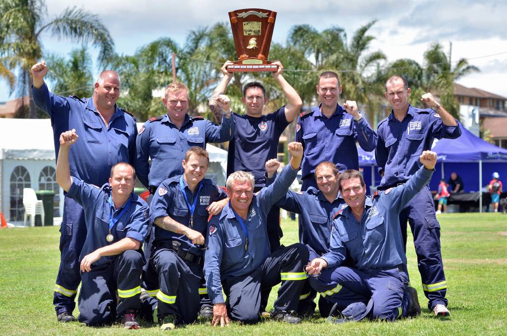 Victory is ours: The Port Macquarie Fire Brigade celebrate the win at the championships yesterday at the conclusion of festivities in Westport park. Pictured (back l to r) Paul Clarke, Daniel Pye, Justin Wright, Damian Buchtmann, Toby Begg, (front) Luc Eddy, Andrew Clark, Don Davidson, Geoff Matthews and Don O’Bree.