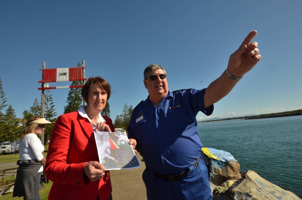  Peter Ellison from Marine Rescue shows MP Leslie Williams the new navigation light at the entrance to the Hastings River.