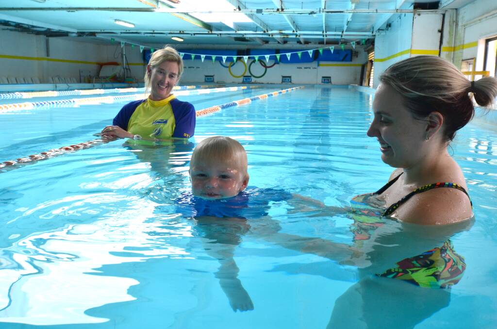 Water message: Little two-year-old Maddyx Welsh enjoys his swimming lessons says mum Courtney McKay. Her biggest fear is that her water-loving son will drown. Behind is swimming instructor and pool owner Helen Todd.