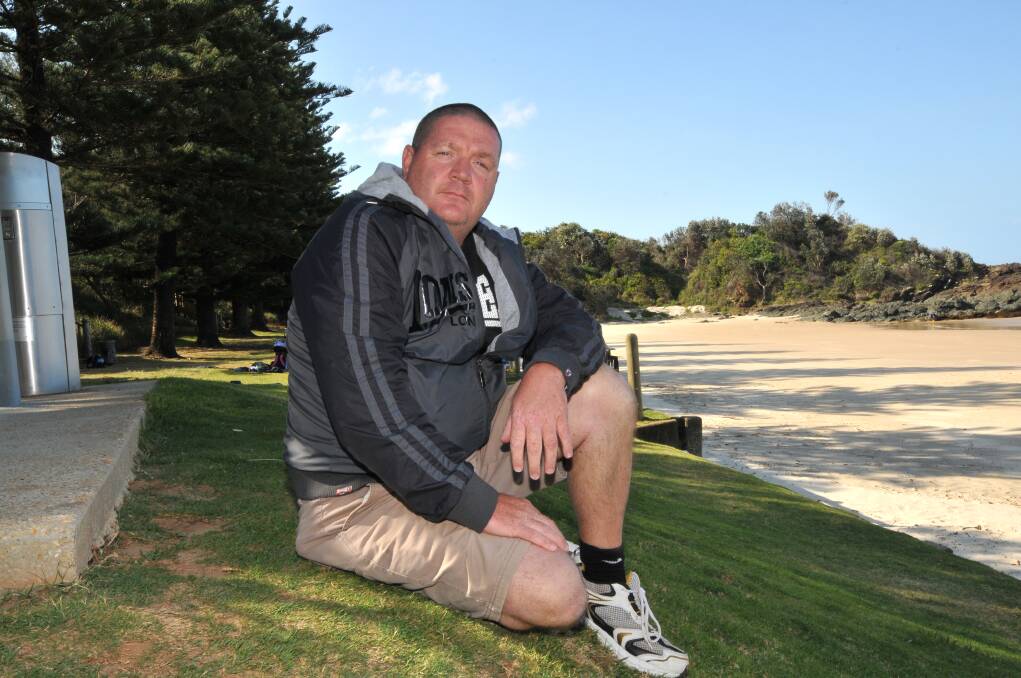 Call to arms: Port Macquarie dad Carl Cochrane is calling for safer beach measures, including regular raking of Town and Flynns beaches and installation of needle  disposal units in public  toilets, after his seven year old son suffered a  needle stick injury at Flynns Beach on Sunday.