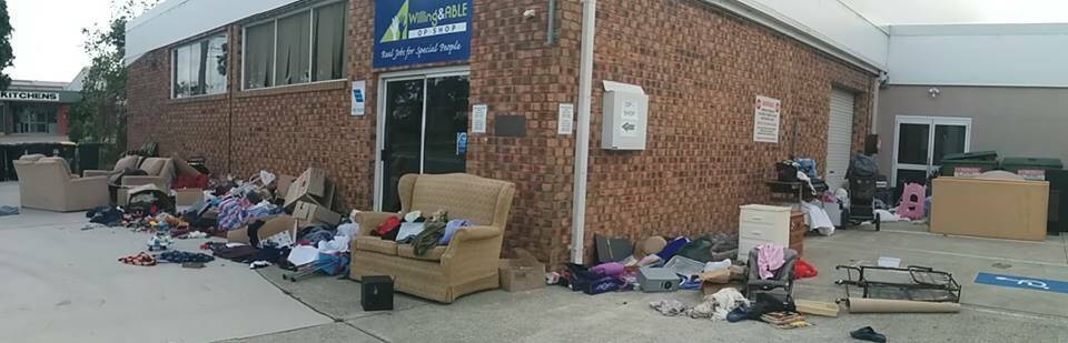 Total disregard: The front of the Willing & Able Foundation Op Shop looked more like a littered land-fill site than a charity over the store's Christmas break., with everything from food scraps to filthy lounges strewn on the concrete