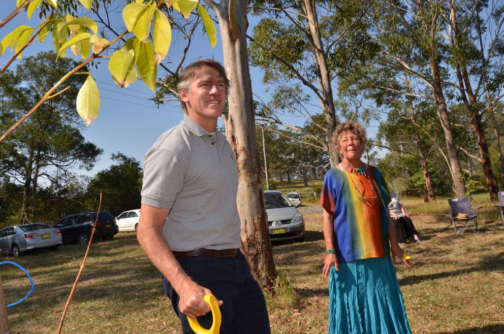 Environmentally friendly: Former Lyne MP Rob Oakeshott and Annie Georgeson plant a tree in honour of the late Ian Bailey at the sustainable village site.