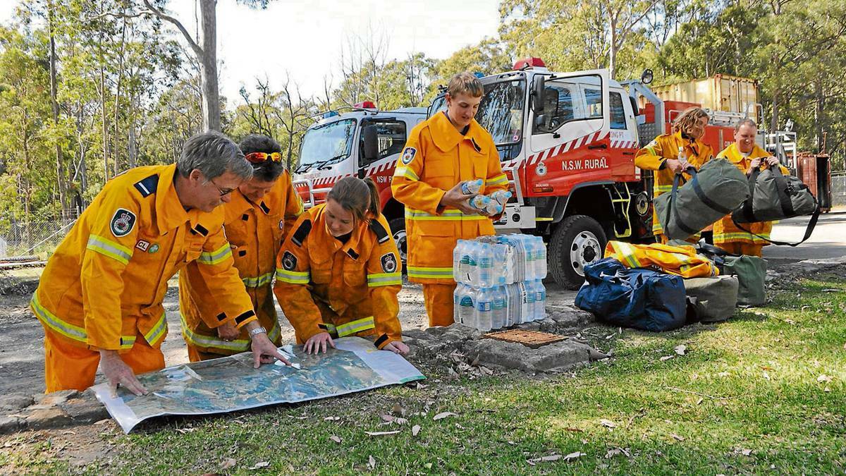 trike team members Peter Cato from Tomerong, Barry McCartney from Greenwell Point, Bec Thompson, Daniel Palmer and Nathanial Smith from Greenwell Point and Shane Bullock from Cunjurong on standby at the Shoalhaven Fire Control Centre. PHOTO: South Coast Register.
