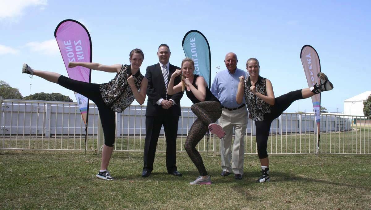 Members of the Australian Dance and Talent Centre Annabel Fleming, Jade Hilard and Alexandra Hernando, who will perform their fitness based Conga routine at the 2014 Newcastle Regional Show. They are pictured with Peter Hodgins and show president Roger Geary. PHOTO: Newcastle Herald.