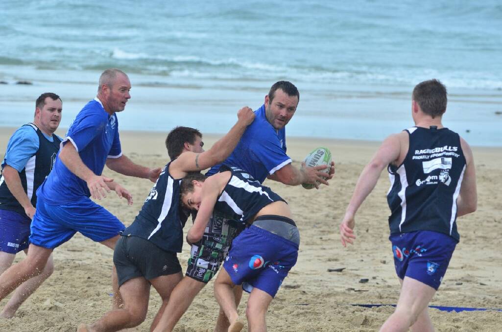 Beach rugby hits the sand, soggy as it was.
