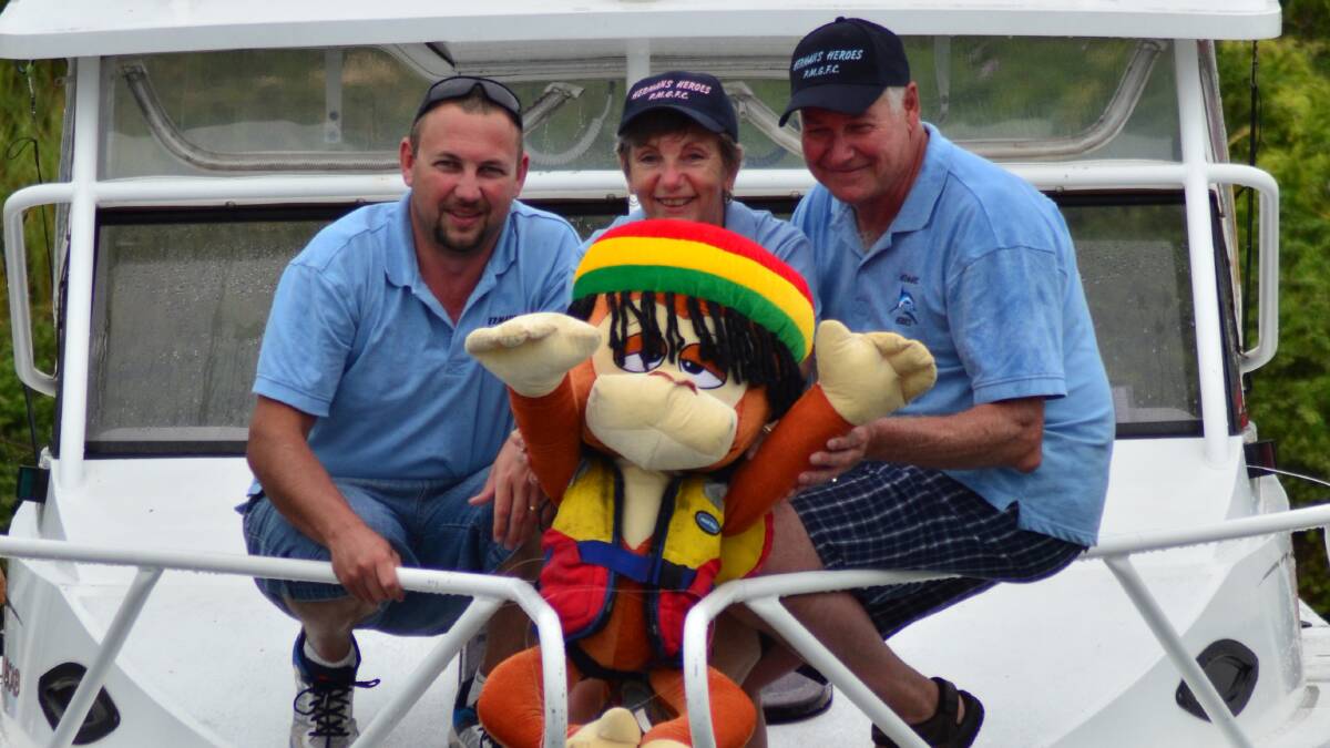 The crew from boat Hermans Heroes Malcolm, Narelle and Herman Kaczorowski with their mascot Bob, who was washed overboard. Luckily, Bob was wearing a life vest and was quickly pulled from the water.