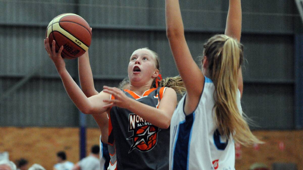 Emily Crampton laying up for the under-15 All Stars team. Pic:  PETER  GLEESON